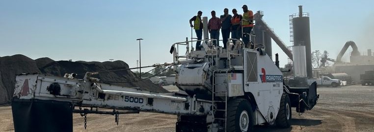 Crew Posing on Equipment